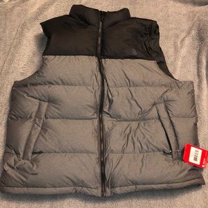 grey and black north face vest